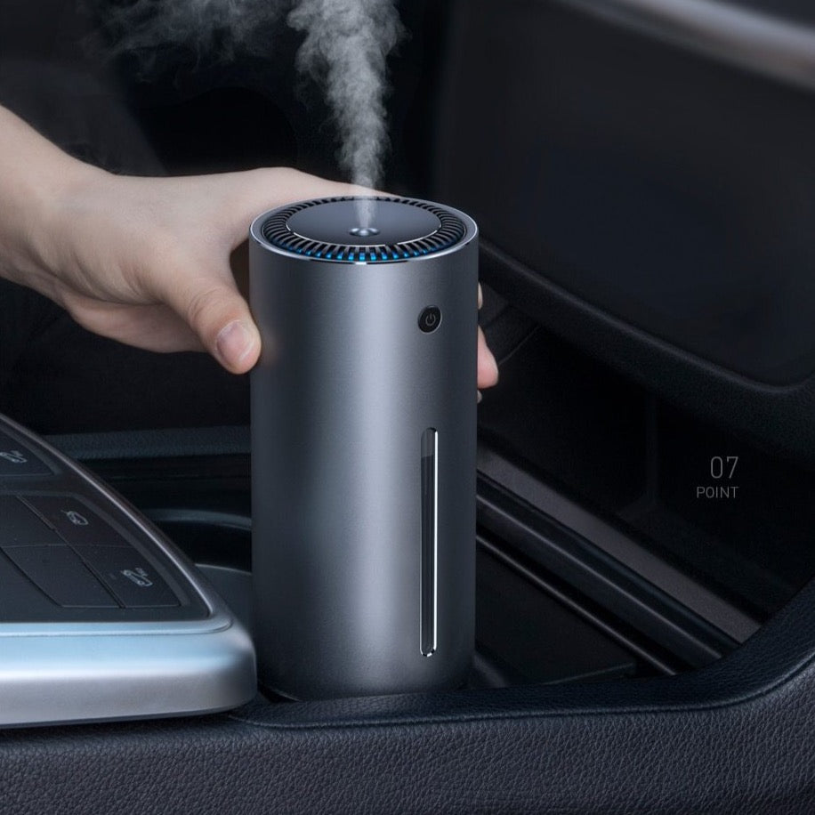 a person using the humidifier in his car 