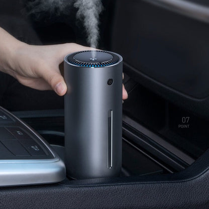 a person using the humidifier in his car 