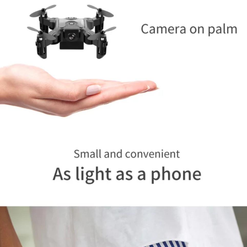 mini drone flying above a person's hand 