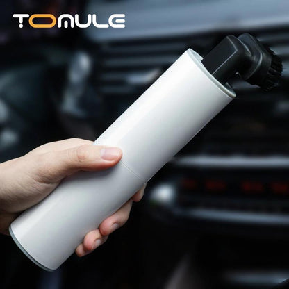 handheld vacuum cleaner being used in the car 