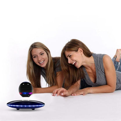 two girls using the floating bluetooth speaker 