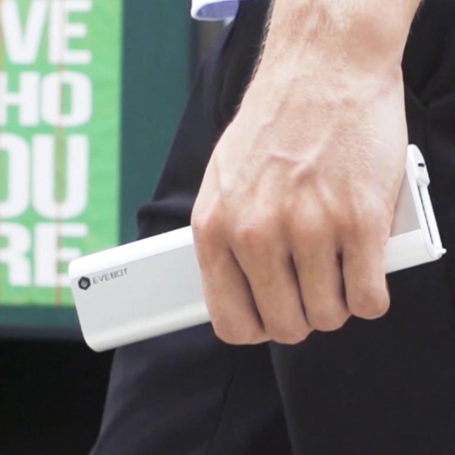 a man using the handheld printer 