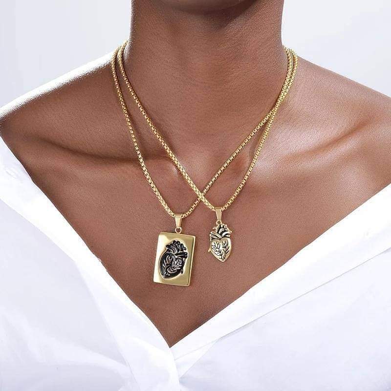 a woman wearing the heart locket golden colour