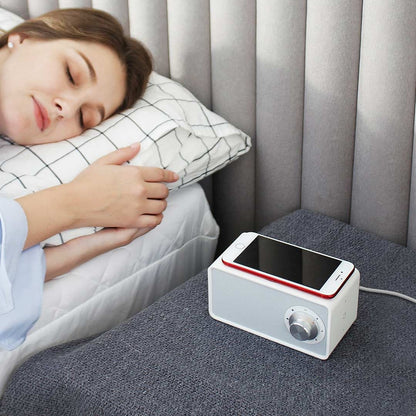 a girl sleeping beside the high end speaker 