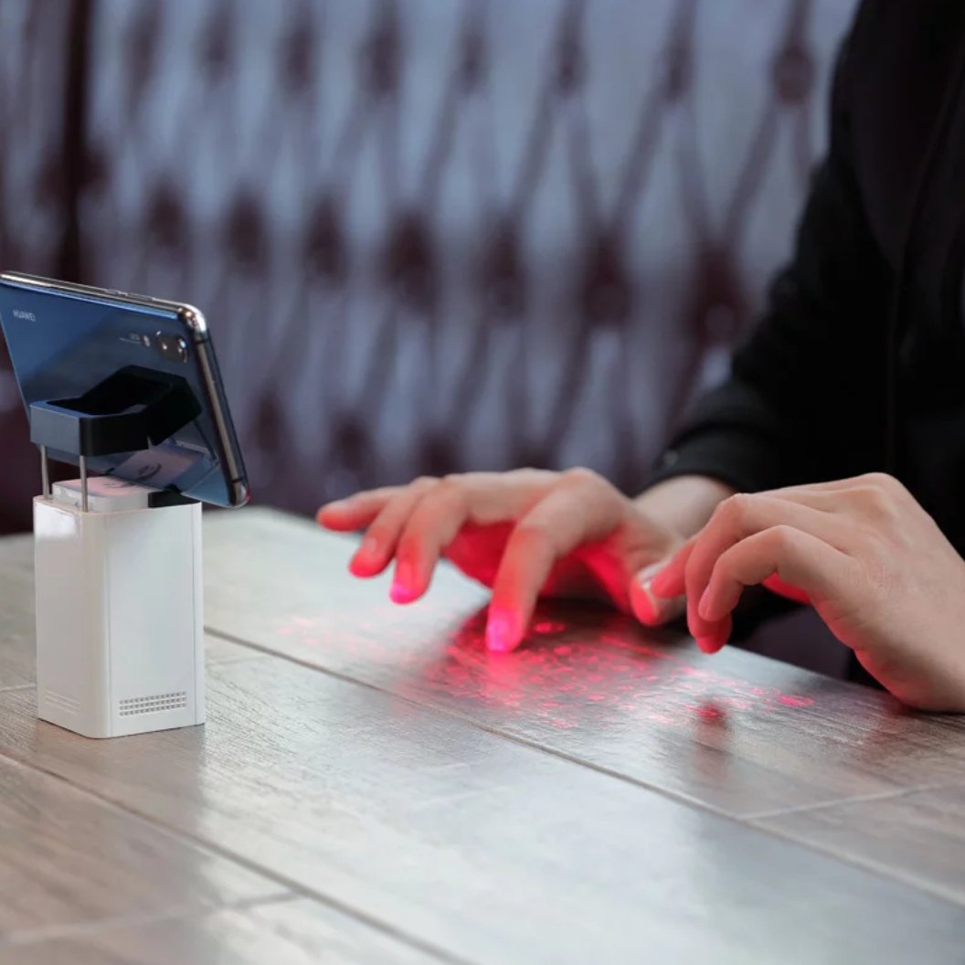 person using the laser keyboard