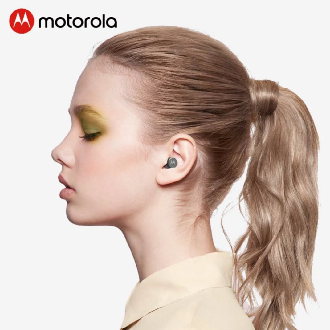 A girl wearing Motorola earbuds 