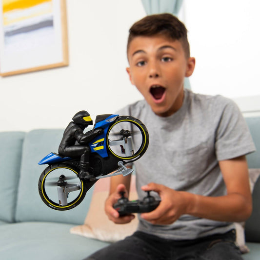 a kid flying the remote control motorcycle 