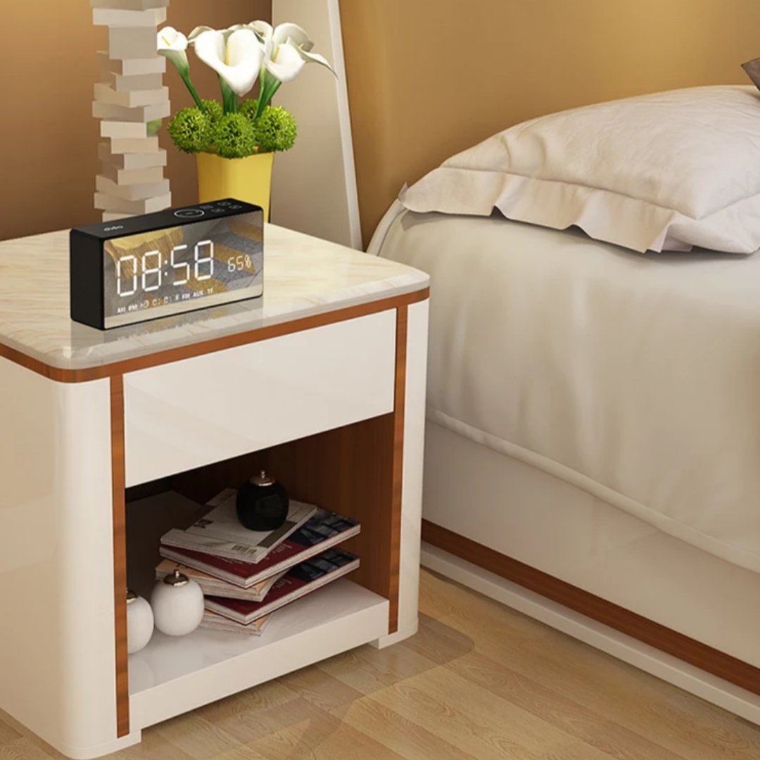 smart alarm clock kept on a side table 