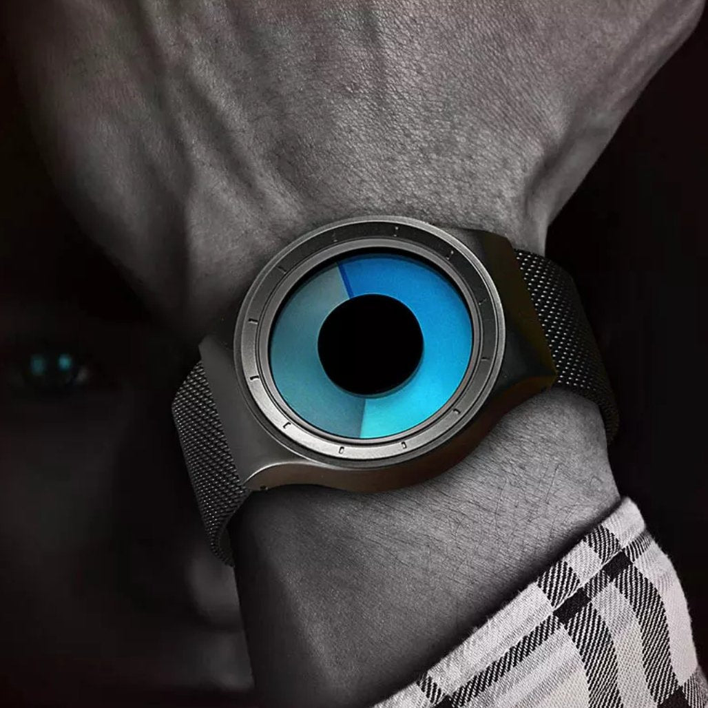 a man with blue eyes wearing the cool watch 